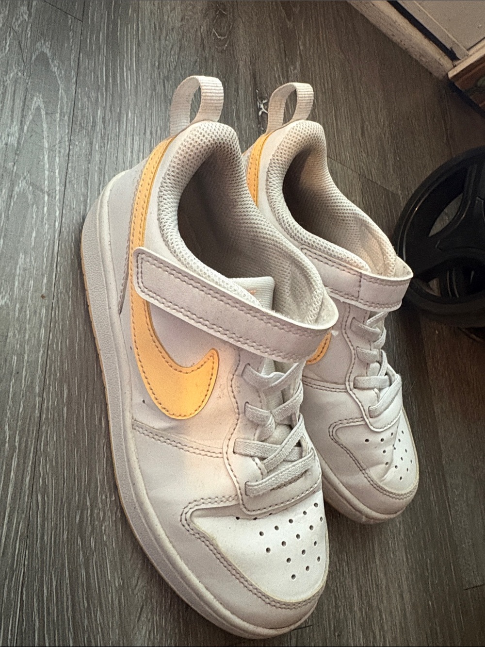 Nike Kids White Sneakers with orange Swoosh
